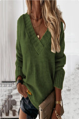 Woman wearing a black V-neck knit sweater with fitted black jeans