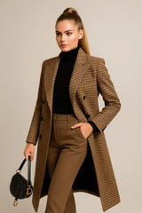 Elegant brown checked wool coat with tailored fit, styled with turtleneck and white sneakers.